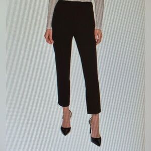 DKNY. Women slim- leg, mid- rise dress pants. Size 2.